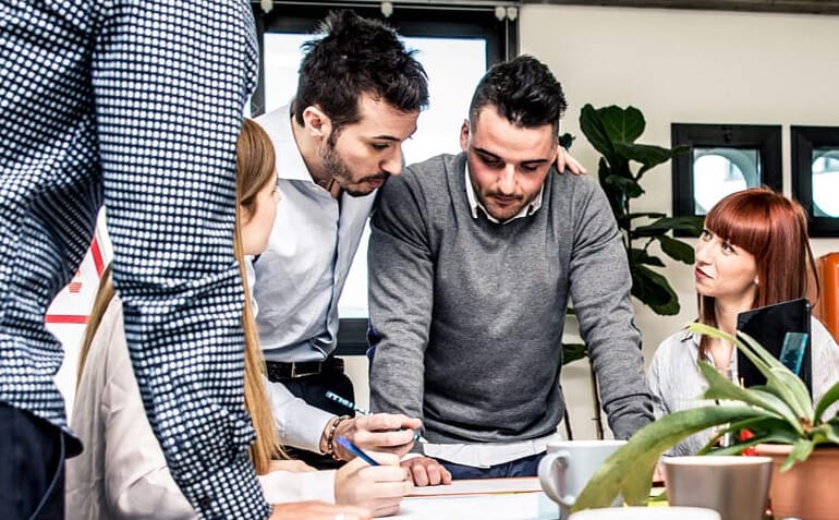 workers discussing marketing project for printing